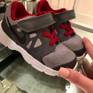 Red and Gray Nike Toddler’s Shoes.